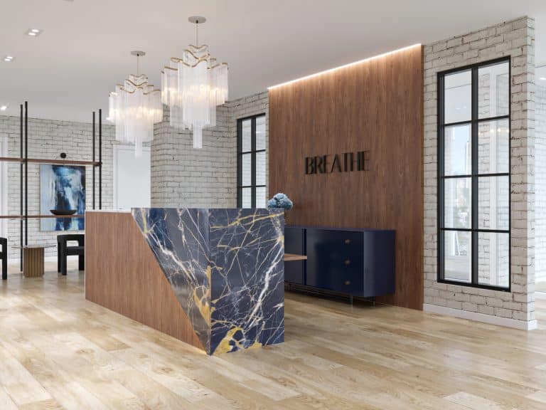 Urban meets luxury in medical office waiting area with custom and vintage accents in marble, wood, and brick
